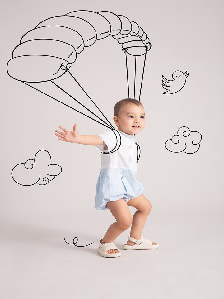 Newborn Baby Blue Organic Cotton One-Piece with a cute baby pose