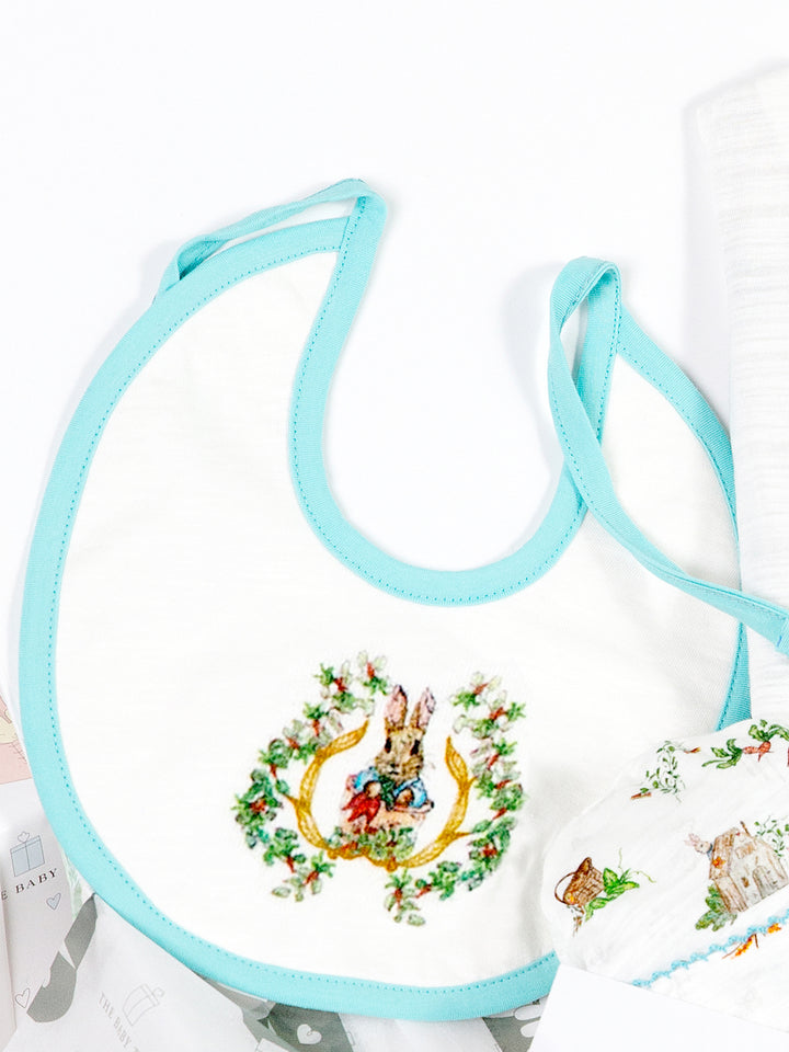 This 'peter Rabbit' themed Bib with a delightful botanical print sounds like a great addition to any baby's wardrobe