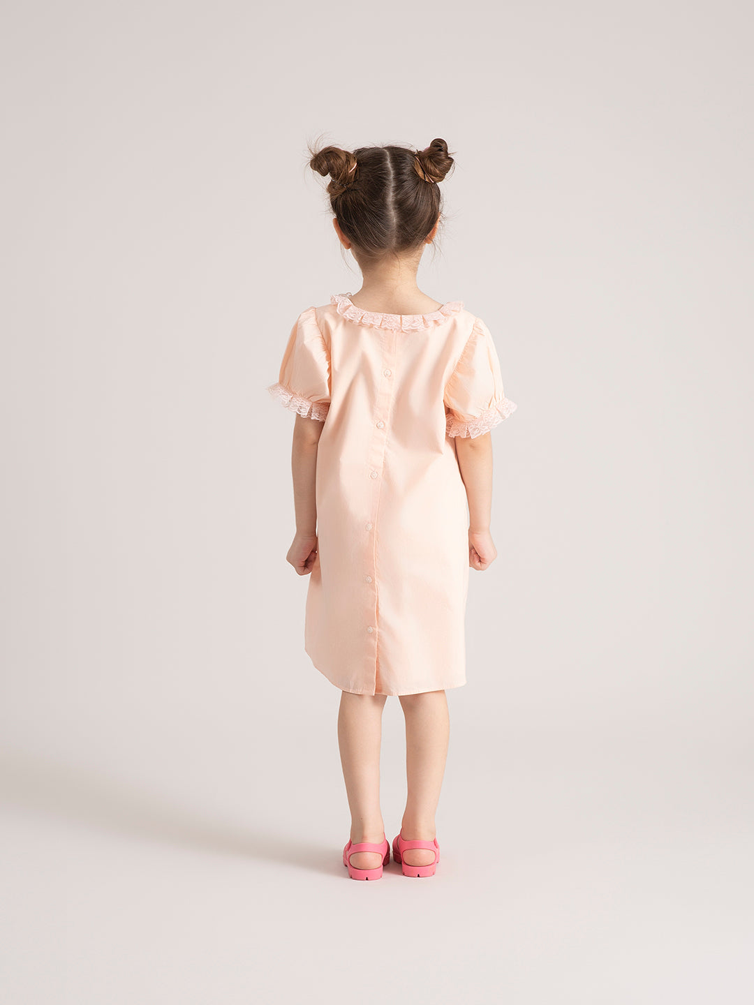 Baby Girl Organic Cotton Peach Bow Dress back pose