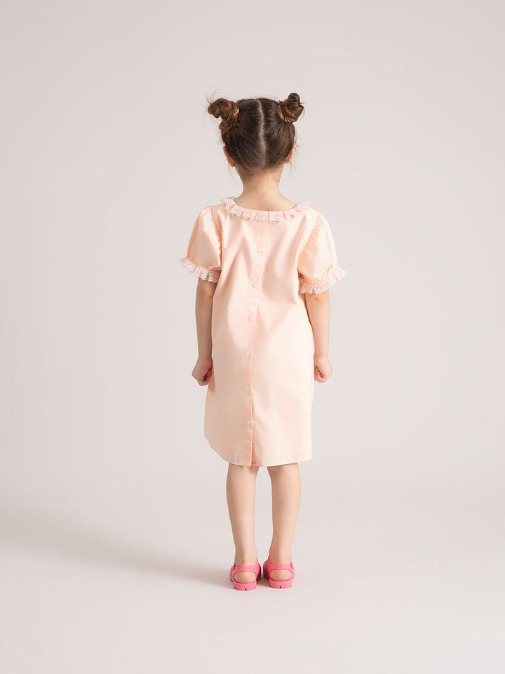 Baby Girl Organic Cotton Peach Bow Dress back pose