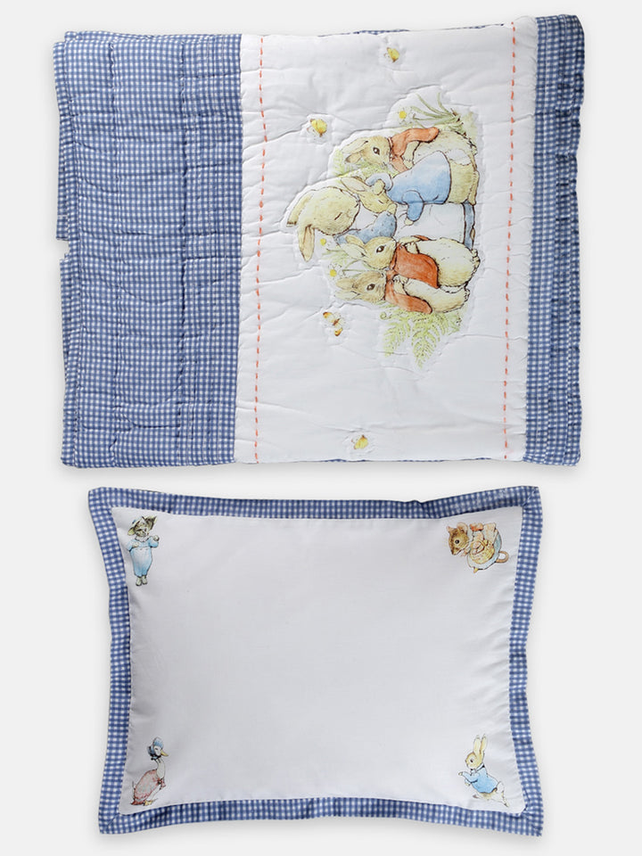 This Peter Rabbit quilt set with a pillow that features an adorable Peter Rabbit print and is made from soft cotton fabric.