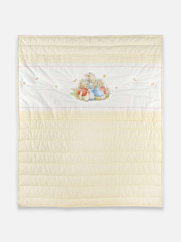 This  yellow Peter Rabbit quilt set with a pillow that features an adorable Peter Rabbit print and is made from soft cotton fabric. The Peter Rabbit print is a classic and timeless design that has been beloved for generations, making it a great choice for a baby gift. 