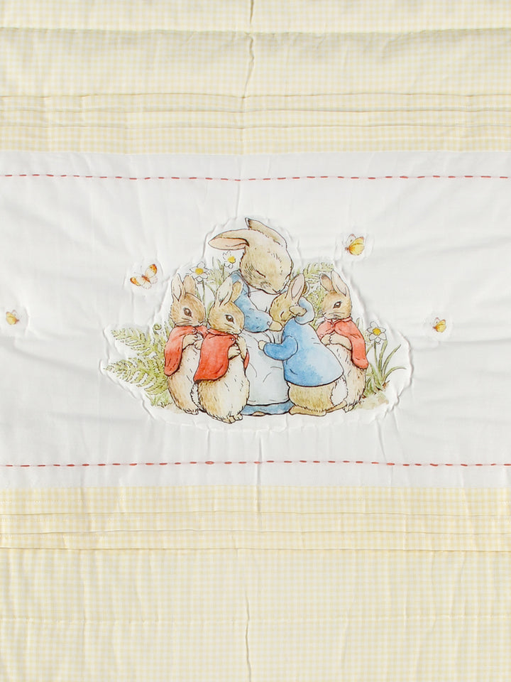 This Peter Rabbit quilt set with a pillow that features an adorable Peter Rabbit print and is made from soft cotton fabric. The Peter Rabbit print is a classic and timeless design that has been beloved for generations, making it a great choice for a baby gift. 